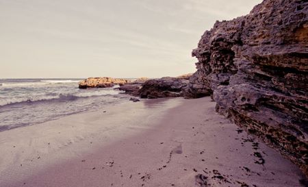 beach with cliffs and surf